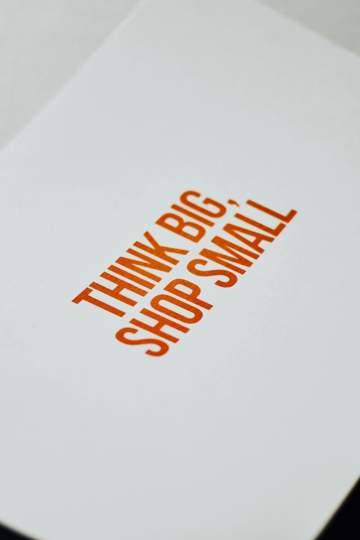 Home Close-up of paper sign with Think Big, Shop Small for support and strategy.